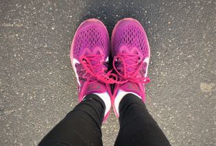 Stacy's feet in magenta running shoes