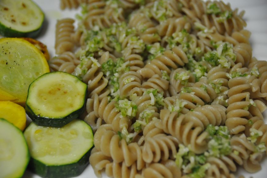 Pasta with garlic scape pesto Plate of rotini topped with garlic scape pesto