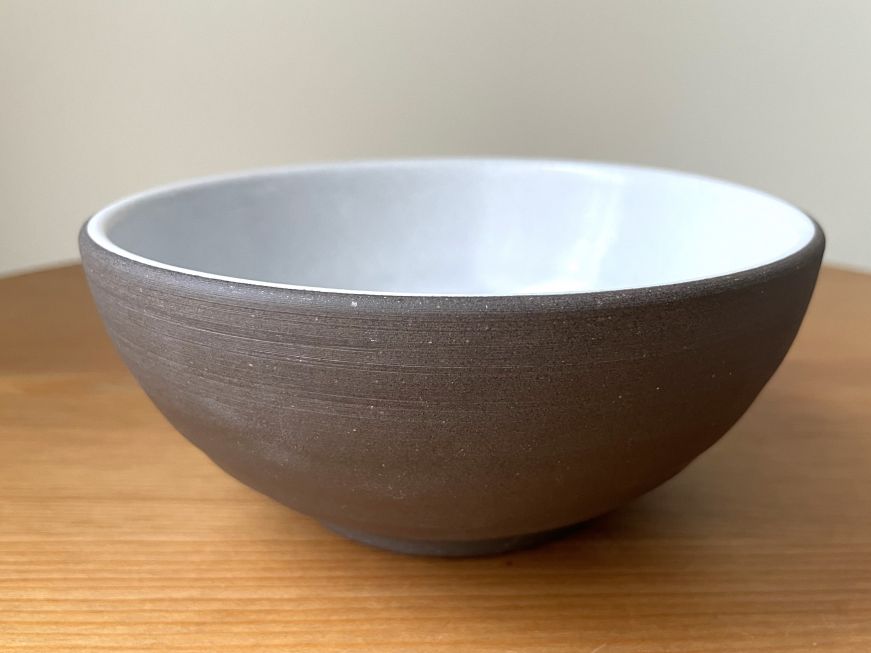 Bowl with a dark brown exterior and white interior