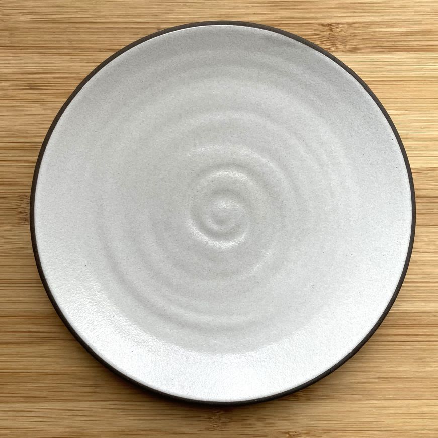 White plate with a dark brown edge