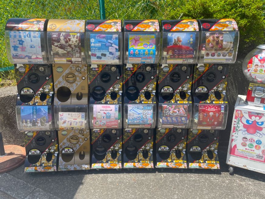 Row of vending machines filled with small toys