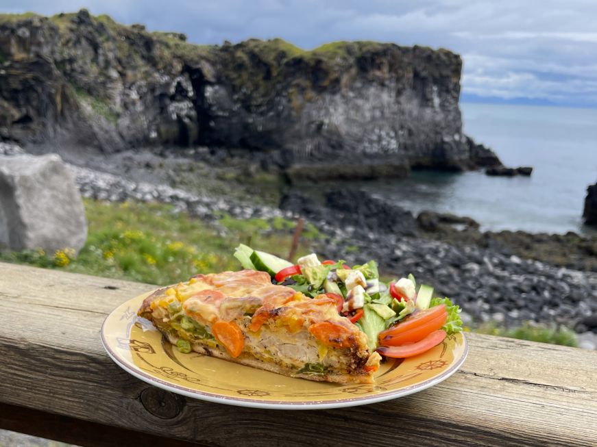 Chicken quiche, Fjöruhúsið Café Chicken quiche with sea cliffs in the background