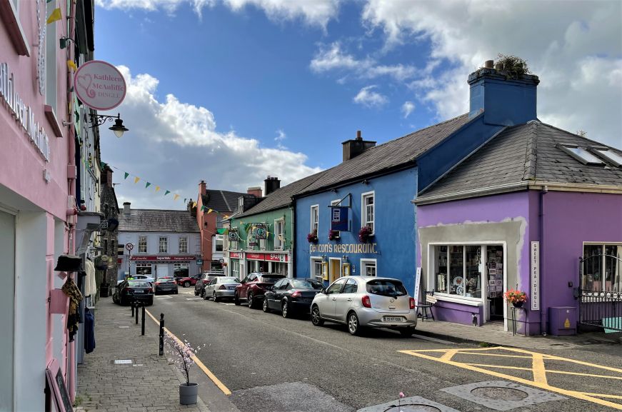 Small town street with brightly colored shops