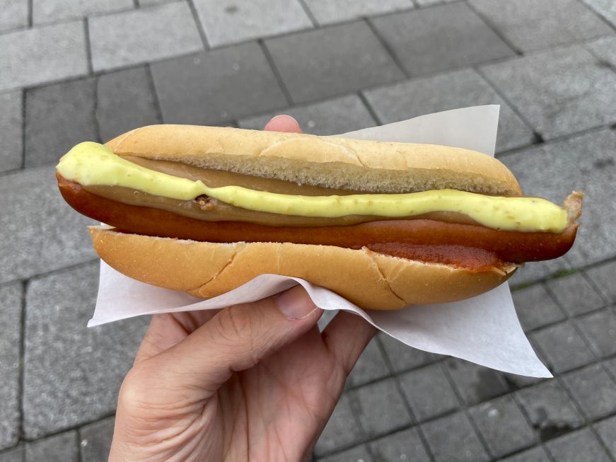 Hot dog with ketchup, mustard, mayo and fried onions Hot dog with ketchup, mustard, mayo and fried onions