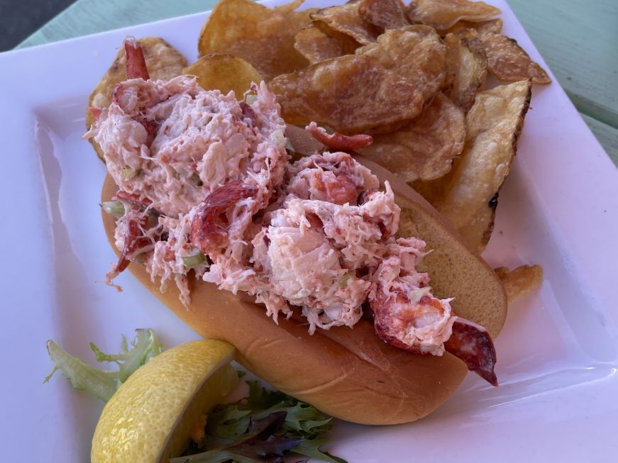 Lobster roll, Waterfront Warehouse Lobster roll on a plate with kettle chips