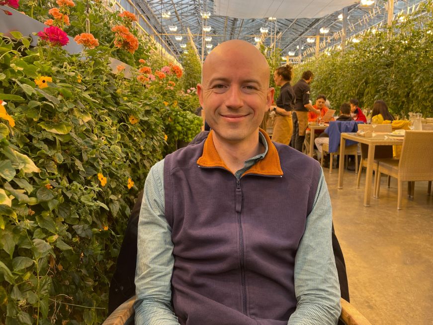 Mike at Friðheimar Mike in the greenhouse dining room at Friðheimar