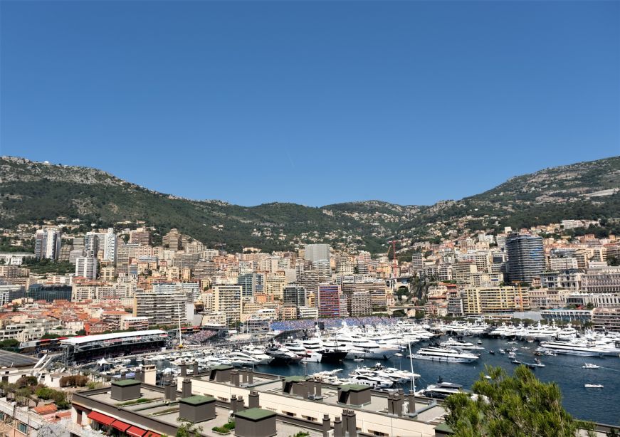 Large port filled with yachts and surrounded by high rises