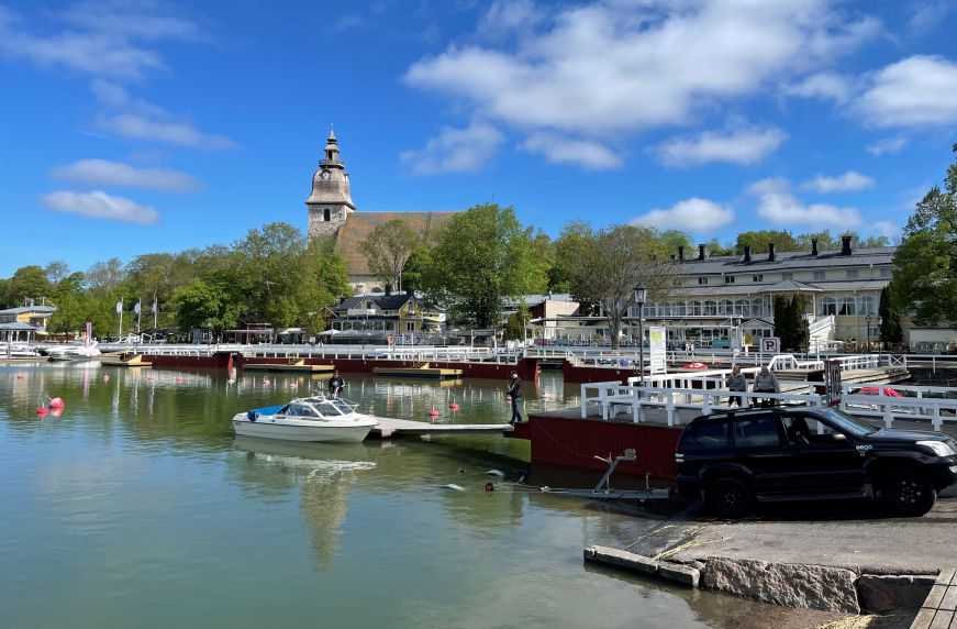 Harbor with boats and church in the background