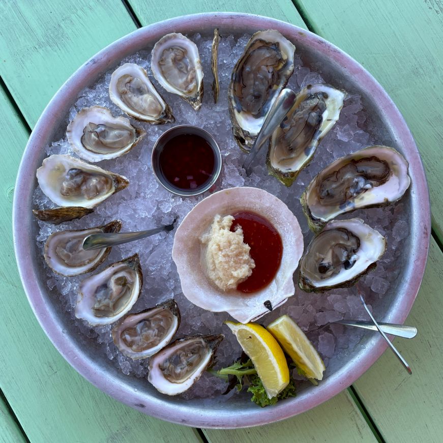 Oysters at Waterfront Warehouse, Halifax Top down view of a dozen oysters in a platter of crushed ice