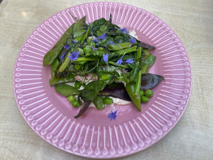 Peas, The Ostrich Club Ricotta, crab meat, and peas on a pink plate