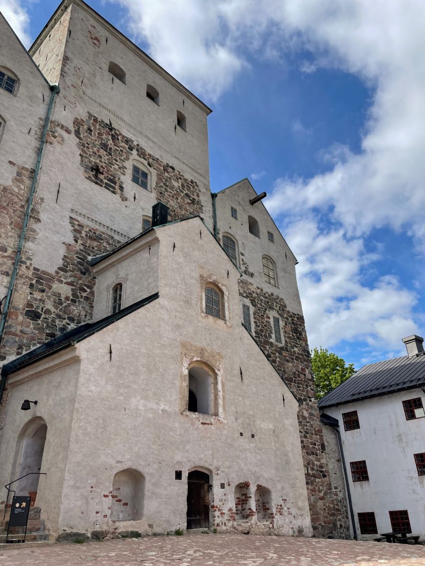 Close up view of an entrance to a white medieval castle