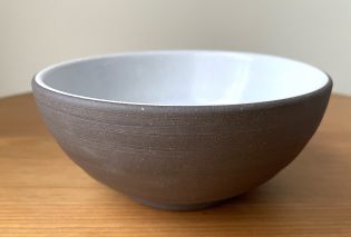 Bowl with a dark brown interior and white interior