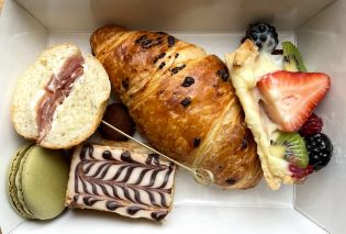 Top down view of a box of miniature pastries